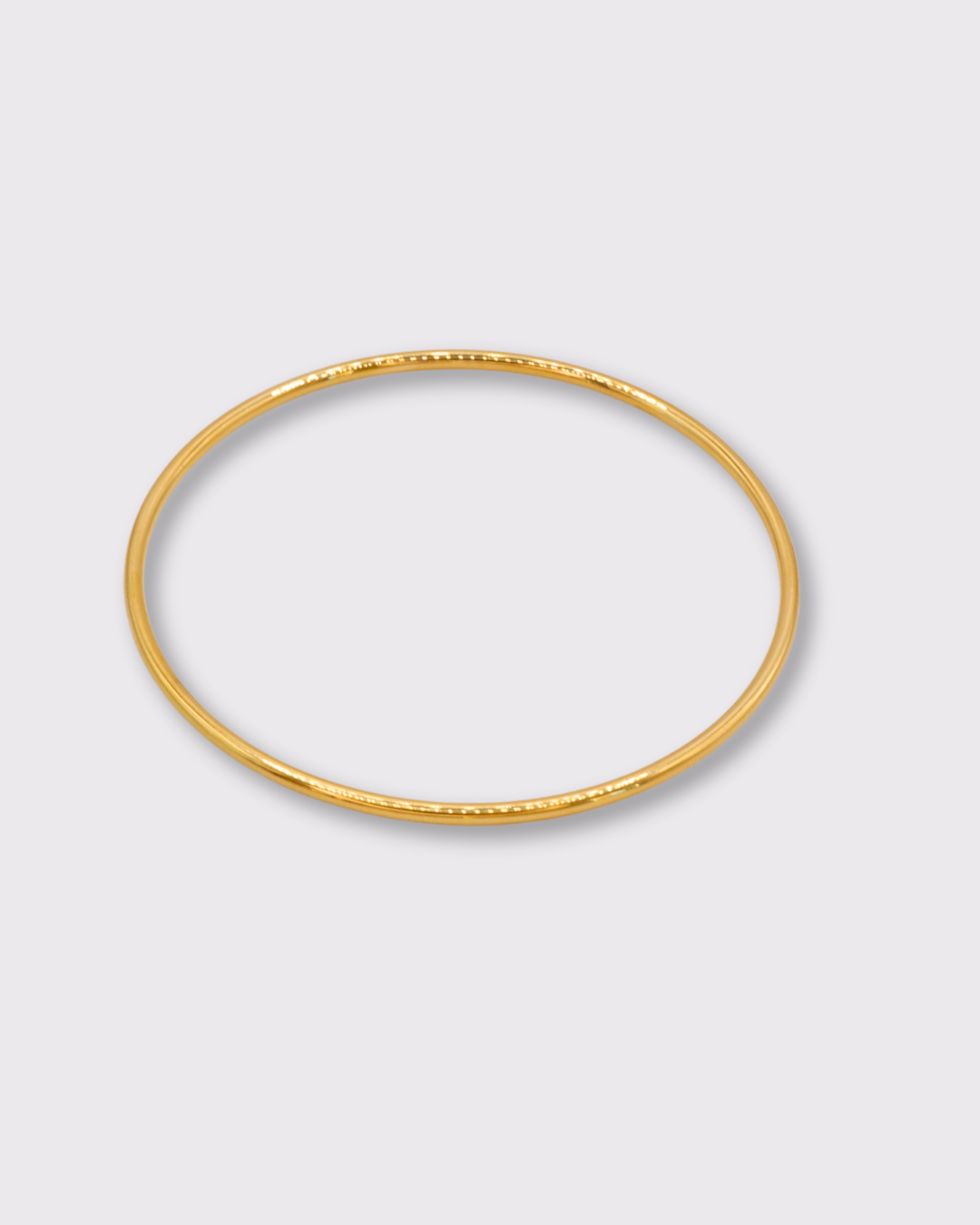 Triomphe bracelet jonc rond en acier inoxydable dorée à l'or 750/1000ème (18 carats) présentation