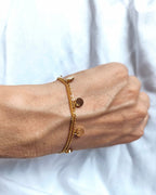 Mystic - bracelet double pastilles porté doré