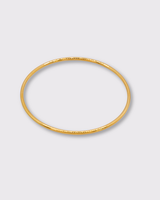 Triomphe bracelet jonc rond en acier inoxydable dorée à l'or 750/1000ème (18 carats) présentation