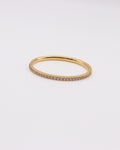 Photo bague zirconium 1mm dorée à l'or 750/1000ème fond gris clair