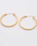 Photo des boucles d'oreilles créoles plates diamètre 32mm