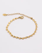Photo du bracelet rond à maille soleil en acier inoxydable doré à l'or 750/1000ème (18 carats) sur fond blanc