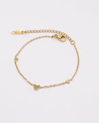 photo du bracelet petit coeurs en acier inoxydable 750/1000ème (18 carats) sur fond gris clair