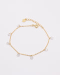 photo bracelet zirconium doré fond gris clair