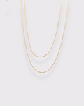 photo collier double serpentine ronde fond gris clair