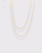 photo collier double serpentine ronde fond gris clair